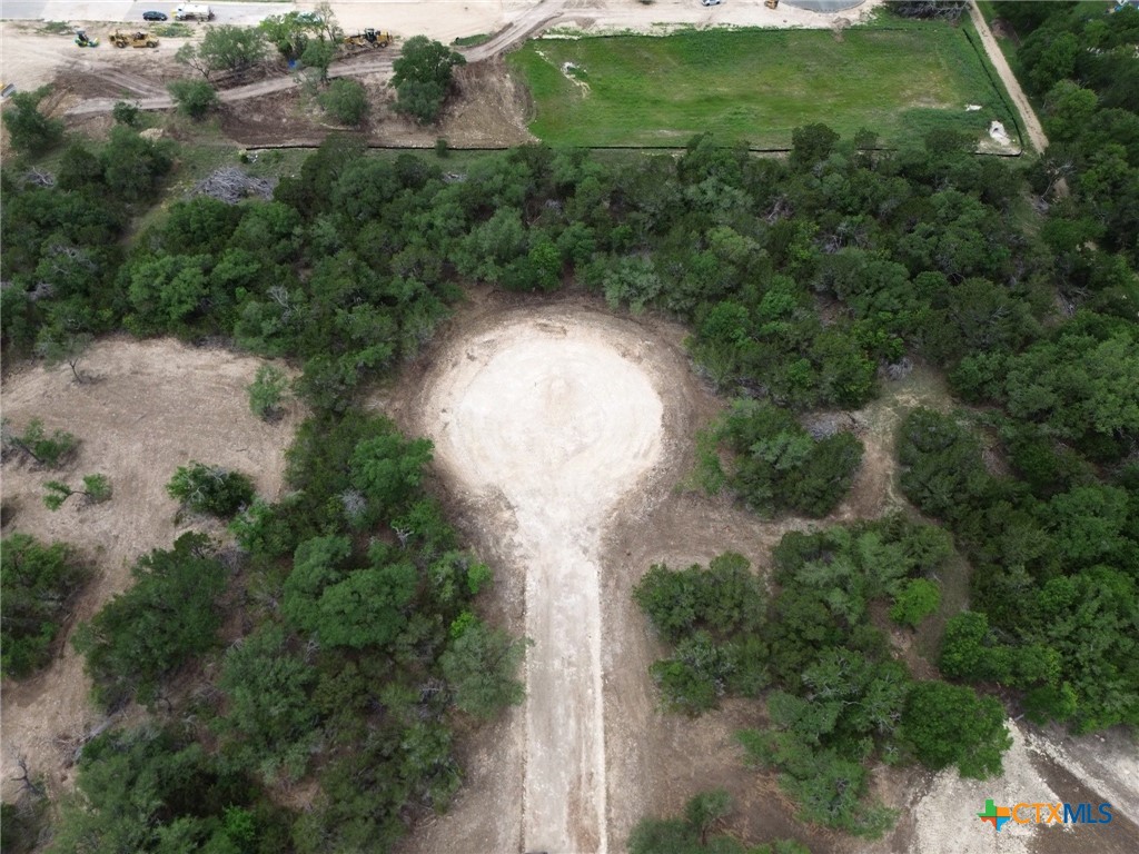 Tbd Lot 49 Tbd Ridge Salado, TX 76571 - Photo 4 of 5 an aerial view of a house with a yard basket ball court and outdoor seating