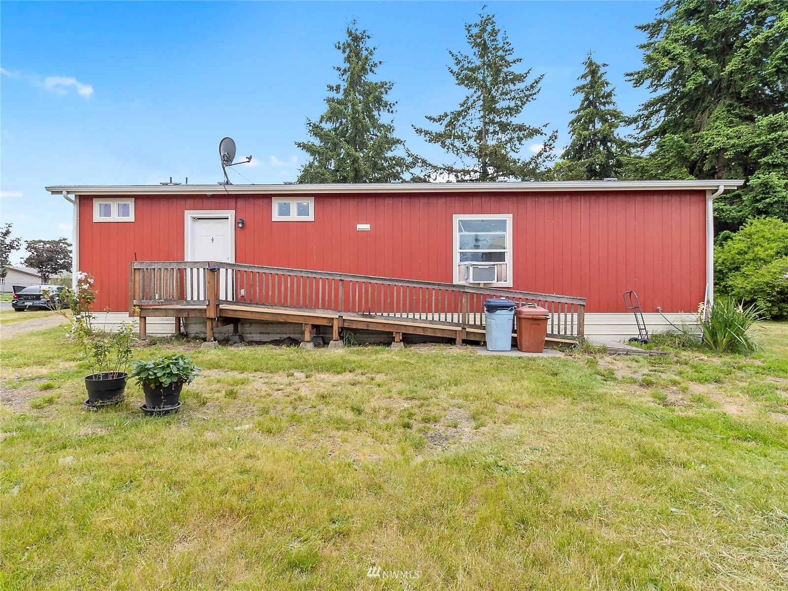 18343 Nutmeg Street Southwest Rochester, WA 98579 - Photo 24 of 31 a view of a backyard with table and chairs
