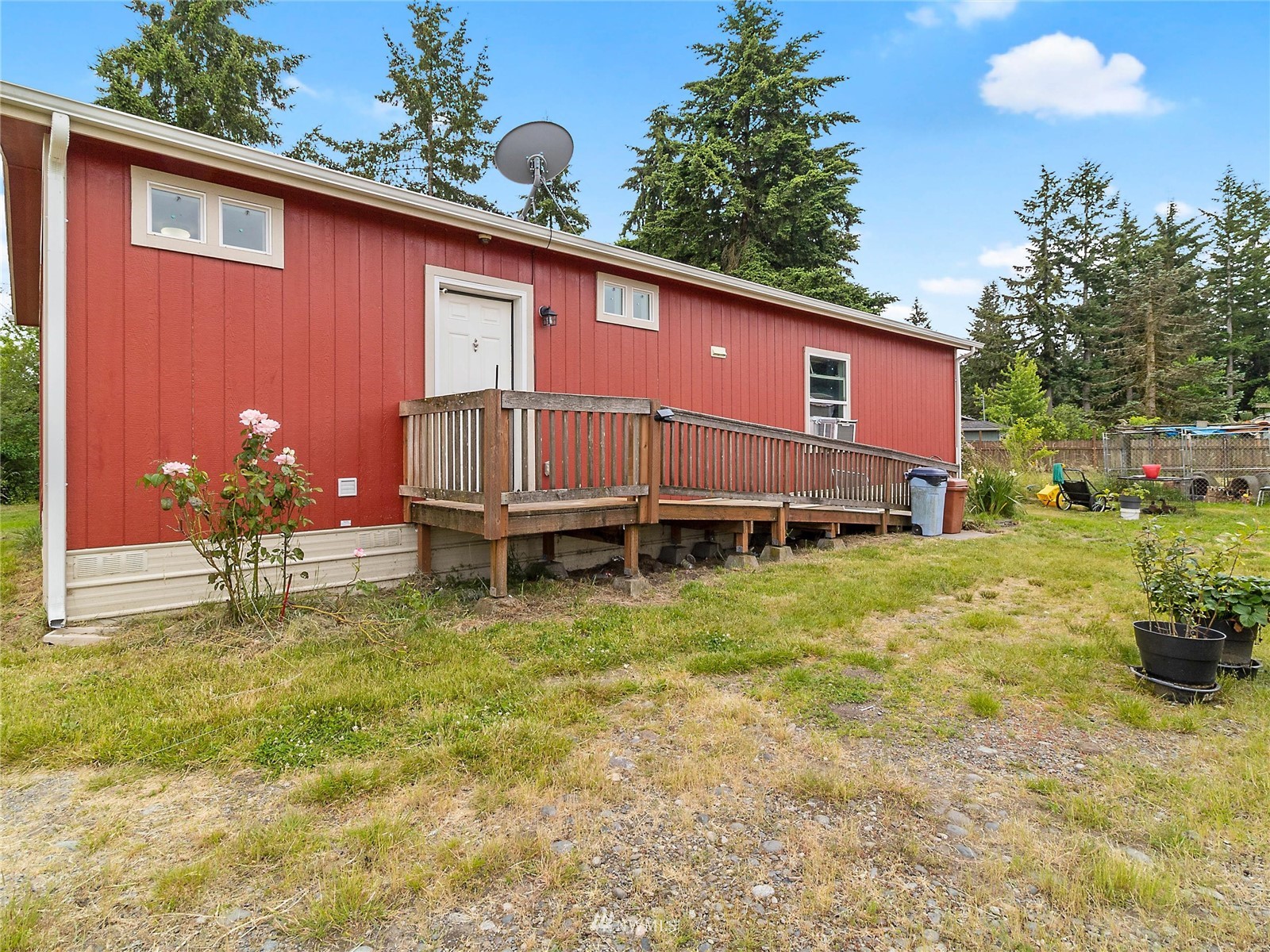 18343 Nutmeg Street Southwest Rochester, WA 98579 - Photo 25 of 31 a backyard of a house with yard and outdoor seating
