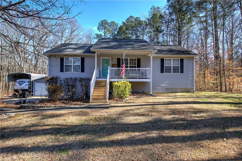 469 Clyde Cole Road Dallas, GA 30157 - Photo 1 of 1 a front view of a house with garden