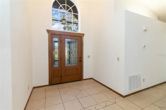 a view of a hallway with entryway door