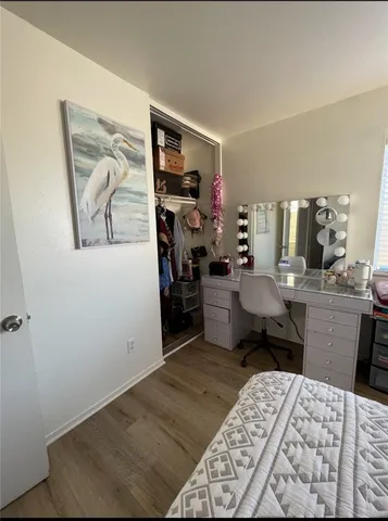 a bed room with a bed and a television