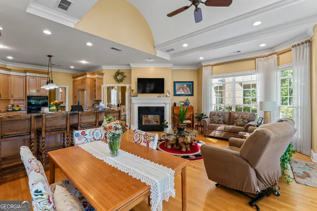 a living room with furniture fireplace and a table
