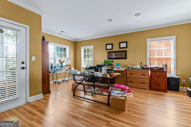 a living room with furniture and wooden floor