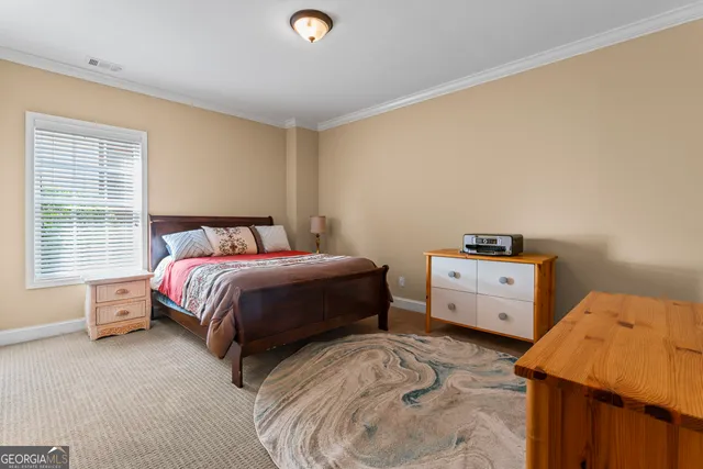 a bedroom with a bed and a closet