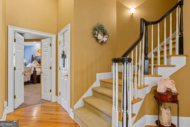 a view of a hallway with a livingroom and entryway
