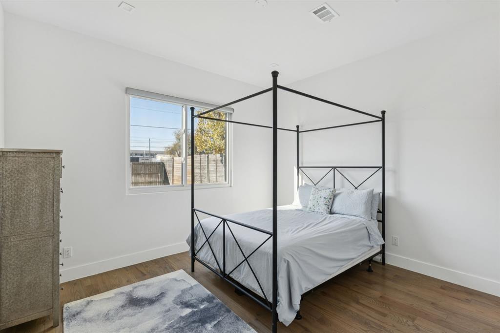 2231 Madera Street Dallas, TX 75206 - Photo 16 of 37 a bedroom with wooden floor and a window