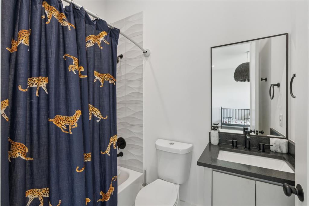 2231 Madera Street Dallas, TX 75206 - Photo 24 of 37 a bathroom with sink mirror and toilet
