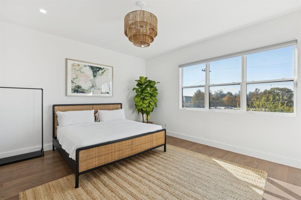 2231 Madera Street Dallas, TX 75206 - Photo 25 of 37 a bedroom with a bed and a window