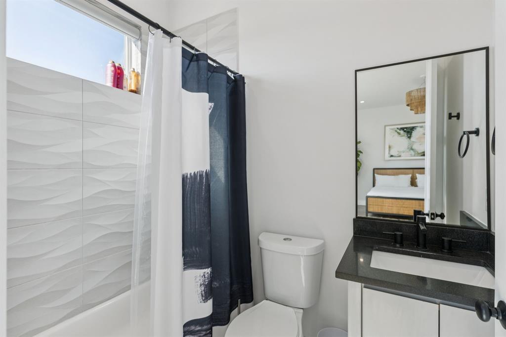 2231 Madera Street Dallas, TX 75206 - Photo 27 of 37 a bathroom with a sink and a mirror