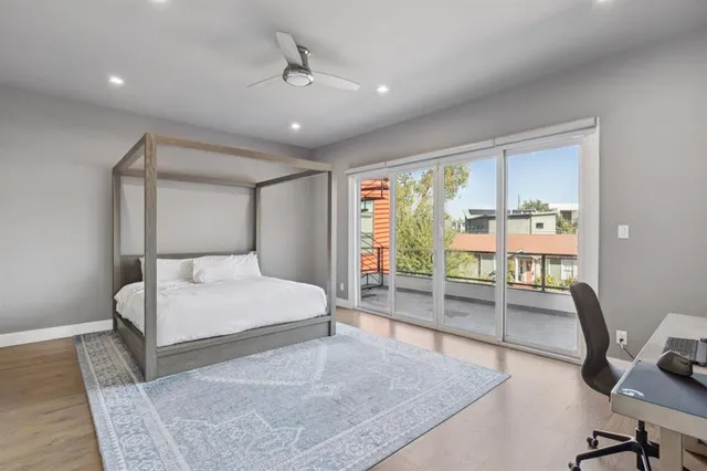 a bedroom with a bed a desk and chair