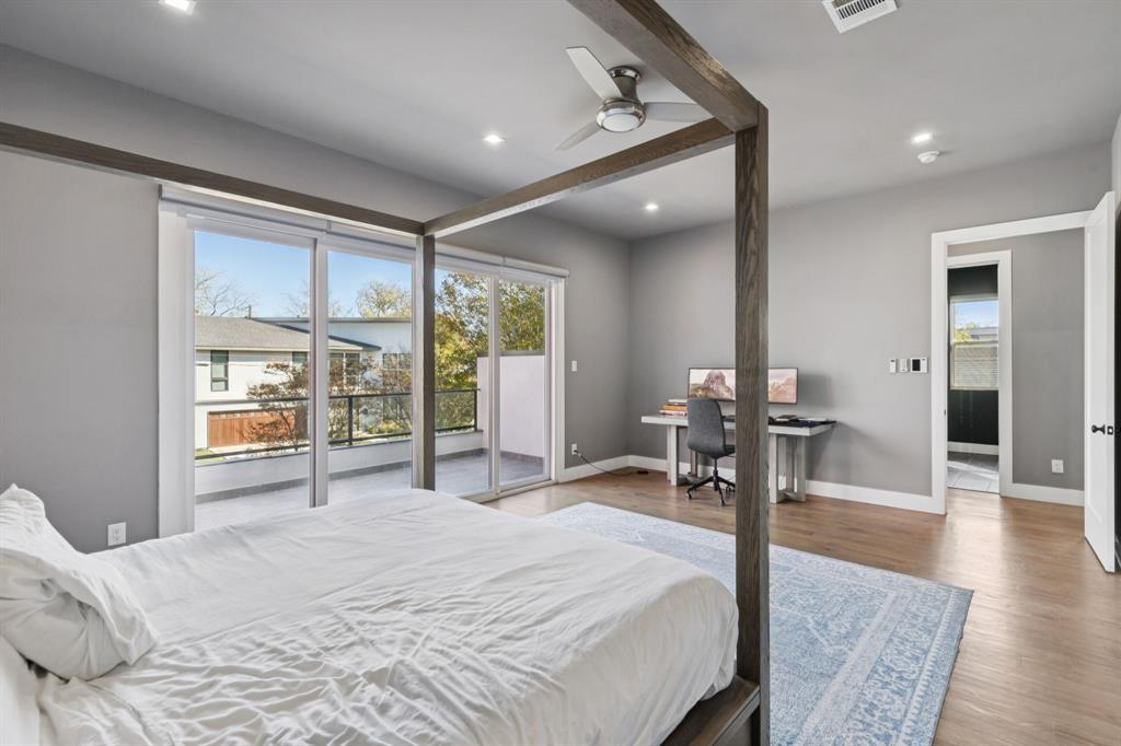 2231 Madera Street Dallas, TX 75206 - Photo 29 of 37 a bedroom with a bed and a large window