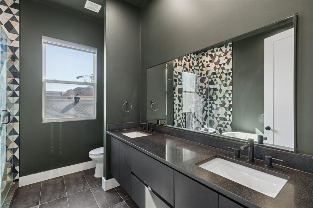 2231 Madera Street Dallas, TX 75206 - Photo 30 of 37 a bathroom with a sink and a mirror