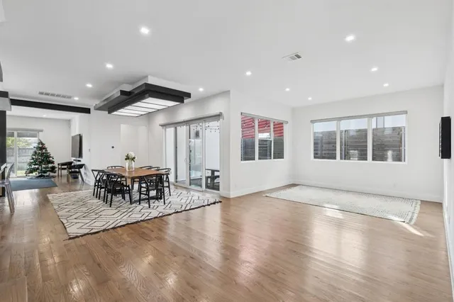 a living room with furniture window and wooden floor