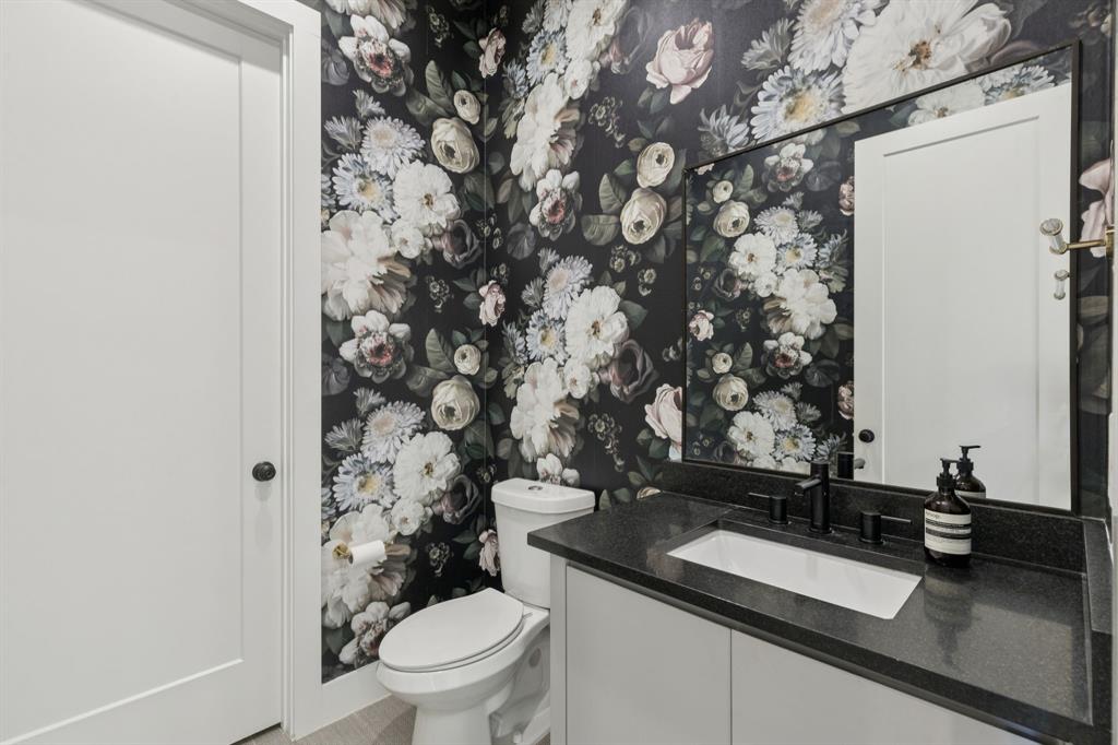 2231 Madera Street Dallas, TX 75206 - Photo 6 of 37 a bathroom with a granite countertop sink and a toilet