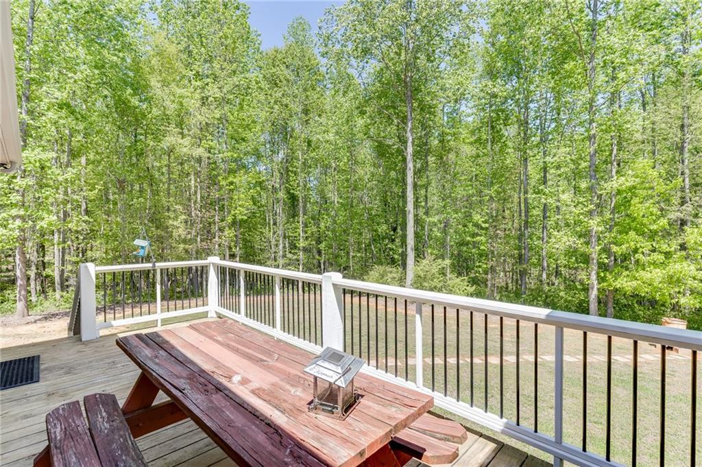 7660 Fern Lane Lula, GA 30554 - Photo 40 of 50 a view of balcony with wooden floor and outdoor seating
