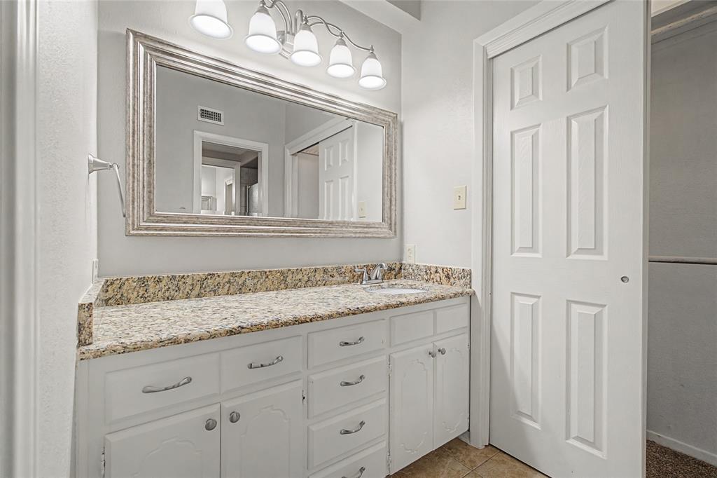 3200 Hickory Court Bedford, TX 76021 - Photo 17 of 30 Bathroom featuring vanity and light tile patterned floors