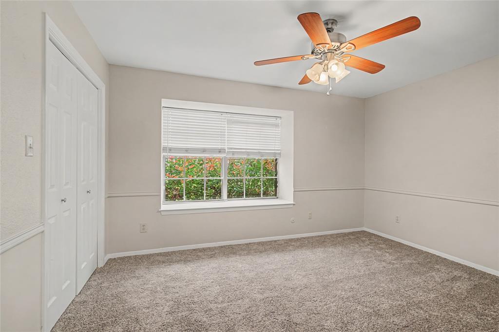 3200 Hickory Court Bedford, TX 76021 - Photo 20 of 30 Unfurnished bedroom featuring carpet flooring, ceiling fan, and a closet