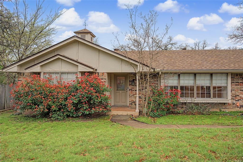 3200 Hickory Court Bedford, TX 76021 - Photo 2 of 30 Single story home with brick siding and a shingled roof