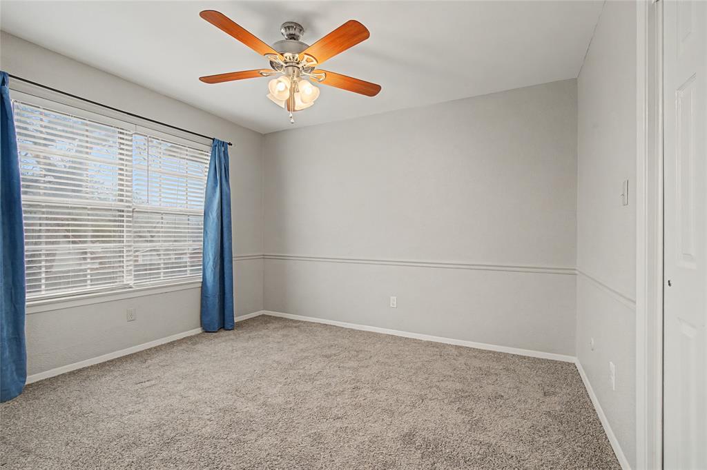 3200 Hickory Court Bedford, TX 76021 - Photo 23 of 30 Spare room with carpet and a ceiling fan