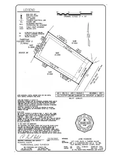 an aerial view of residential house with outdoor space and trees all around