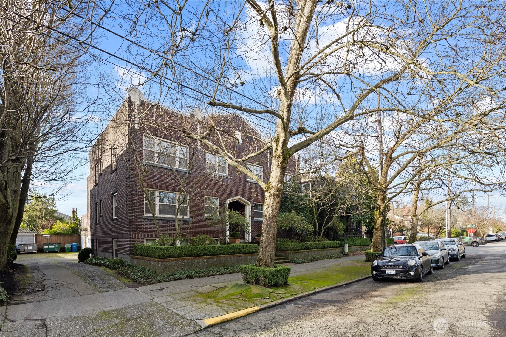 741 Federal Avenue East Seattle, WA 98102 - Photo 2 of 21 a view of a parked cars in front of brick building