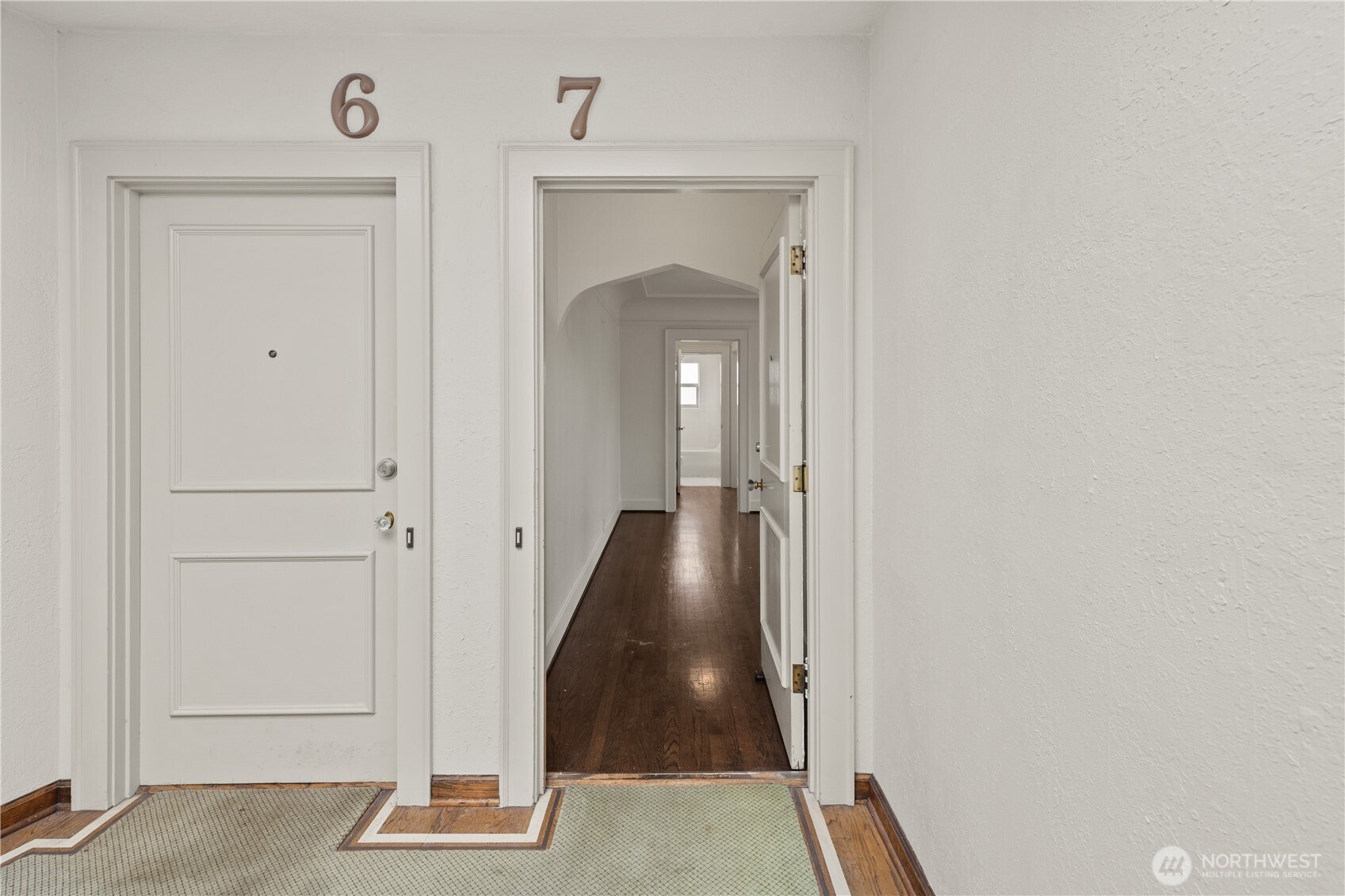 741 Federal Avenue East Seattle, WA 98102 - Photo 3 of 21 a view of a hallway with wooden floor and staircase