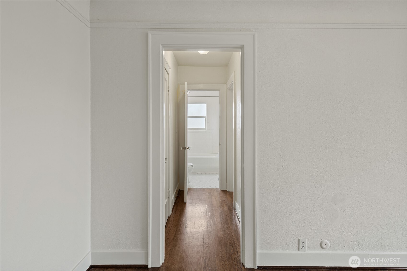 741 Federal Avenue East Seattle, WA 98102 - Photo 7 of 21 a view of a hallway with wooden floor