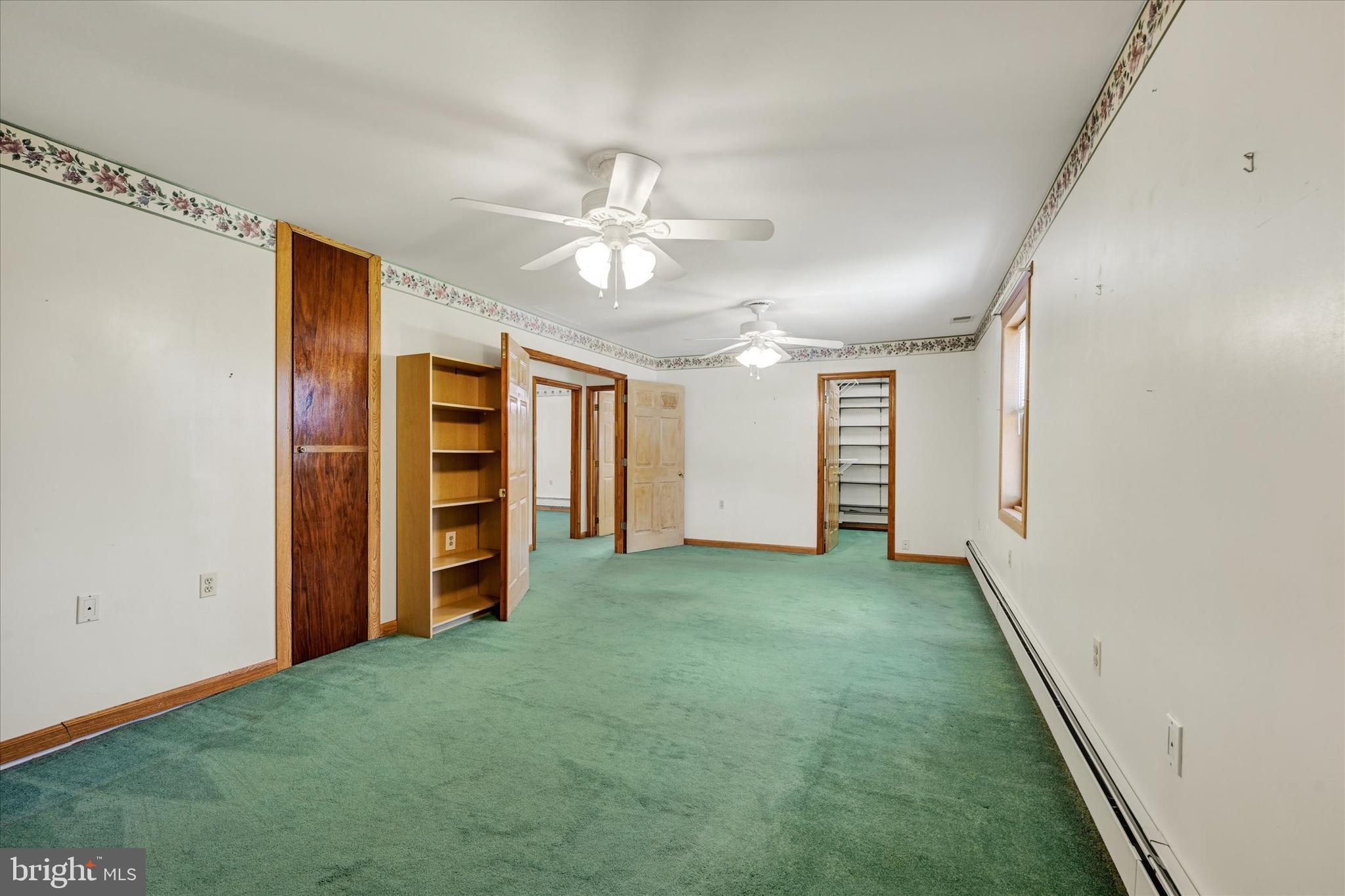 7848 Oakdale Avenue Rosedale, MD 21237 - Photo 18 of 46 an empty room with closet and ceiling fan