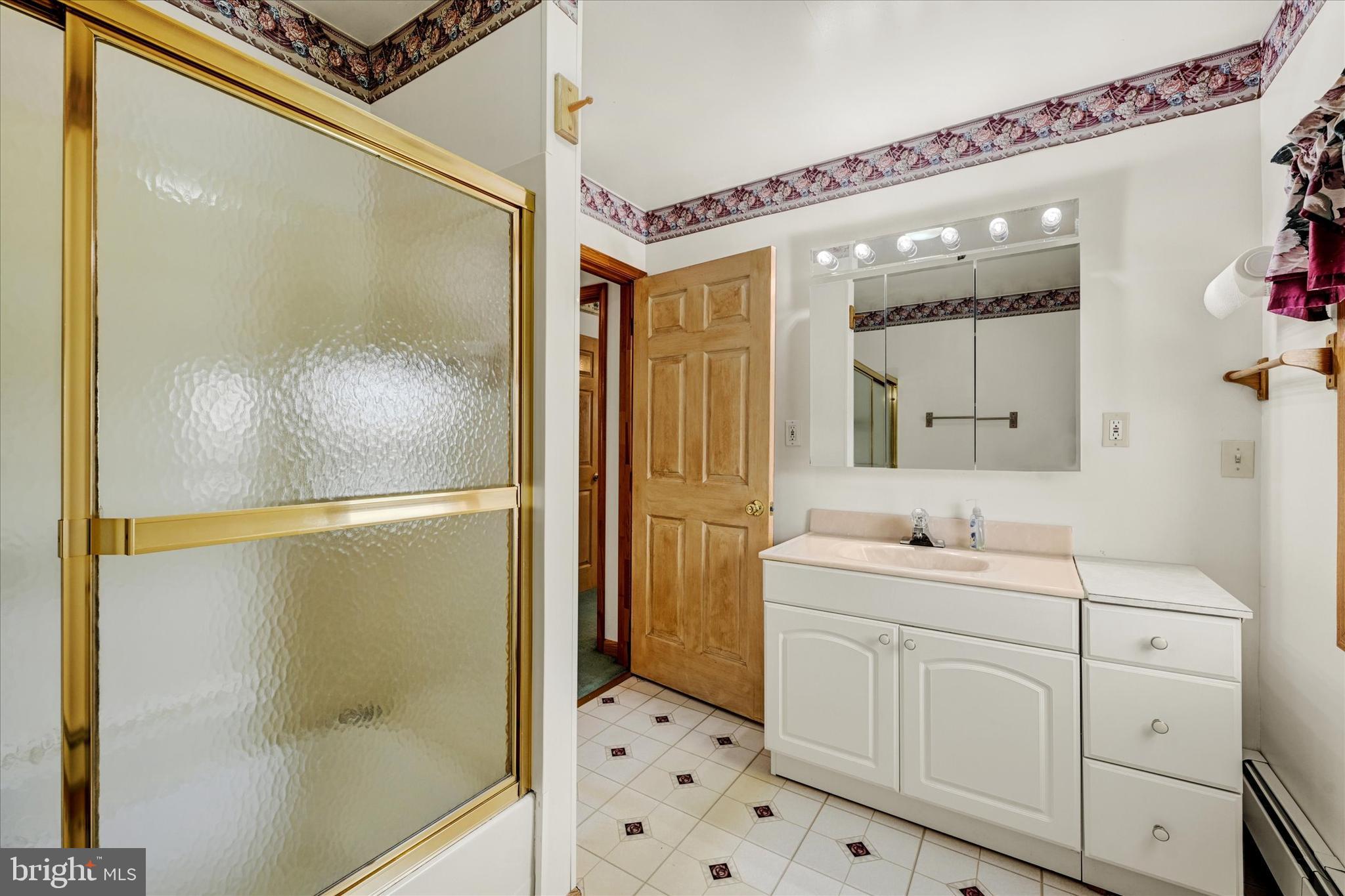 7848 Oakdale Avenue Rosedale, MD 21237 - Photo 20 of 46 a bathroom with a double vanity sink mirror and shower