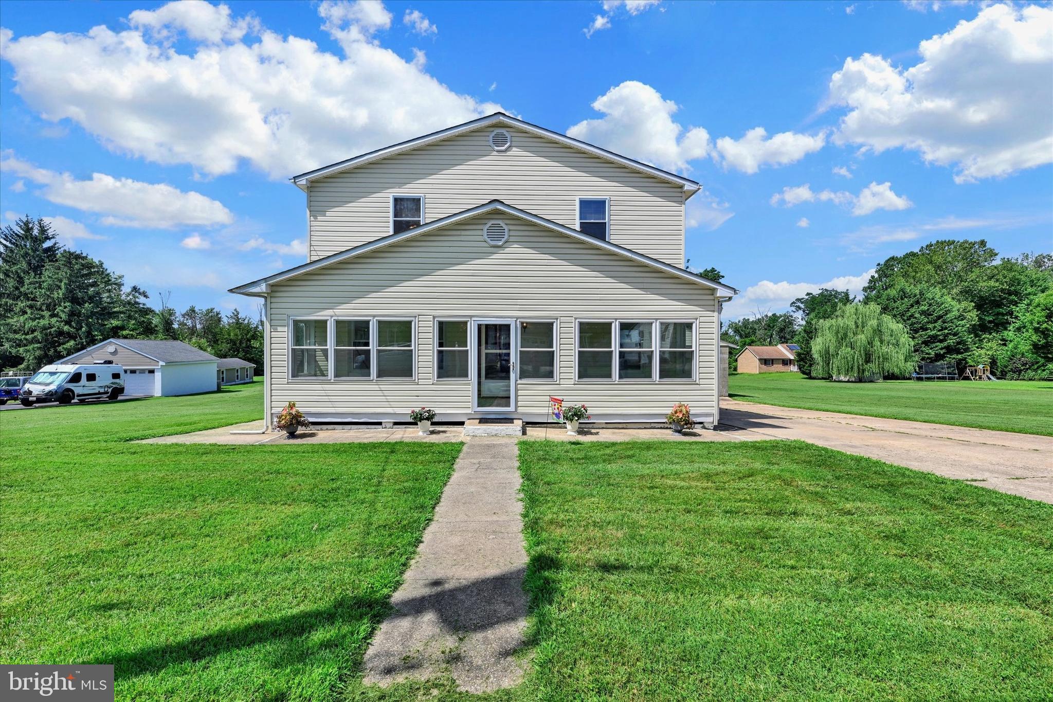 7848 Oakdale Avenue Rosedale, MD 21237 - Photo 2 of 46 a front view of a house with a yard