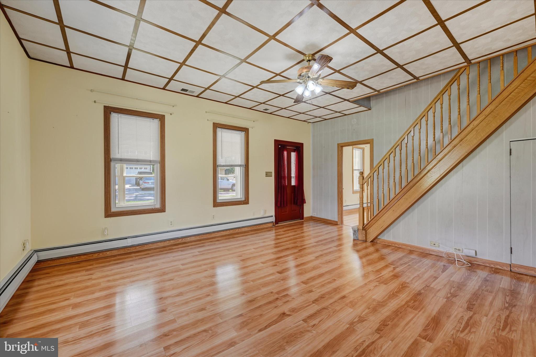 7848 Oakdale Avenue Rosedale, MD 21237 - Photo 6 of 46 a big room with wooden floor and windows