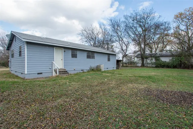 a view of backyard with trampoline