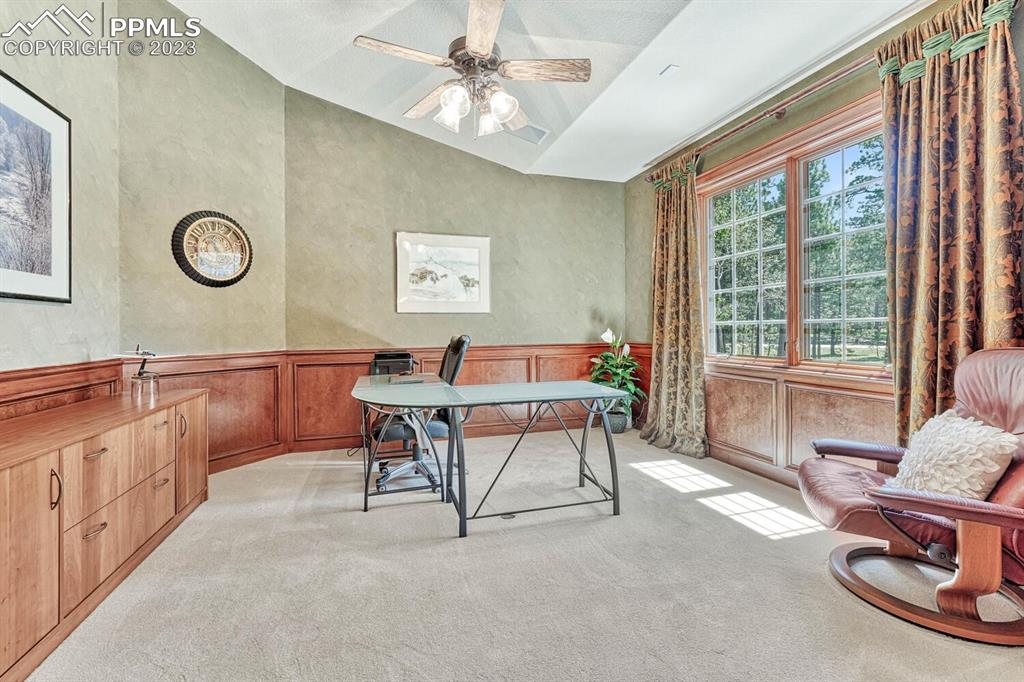 17890 Queensmere Drive Monument, CO 80132 - Photo 15 of 50 a living room with furniture and a large window