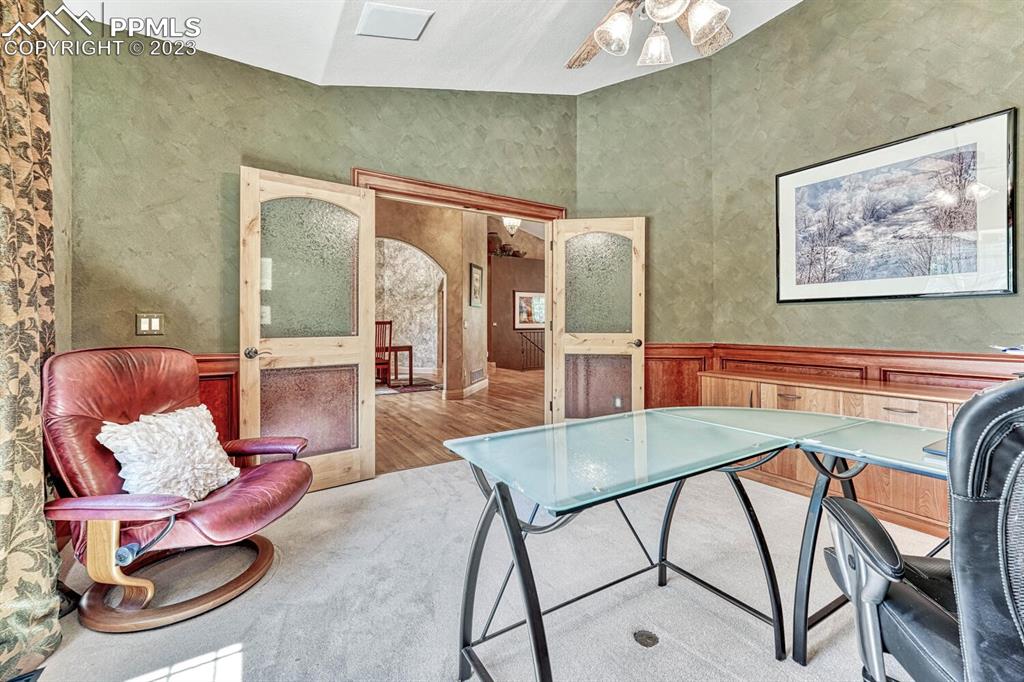 17890 Queensmere Drive Monument, CO 80132 - Photo 16 of 50 a view of a dining room with furniture and a potted plant