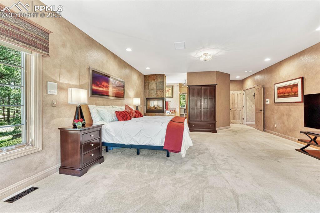 17890 Queensmere Drive Monument, CO 80132 - Photo 19 of 50 a bedroom with furniture and window