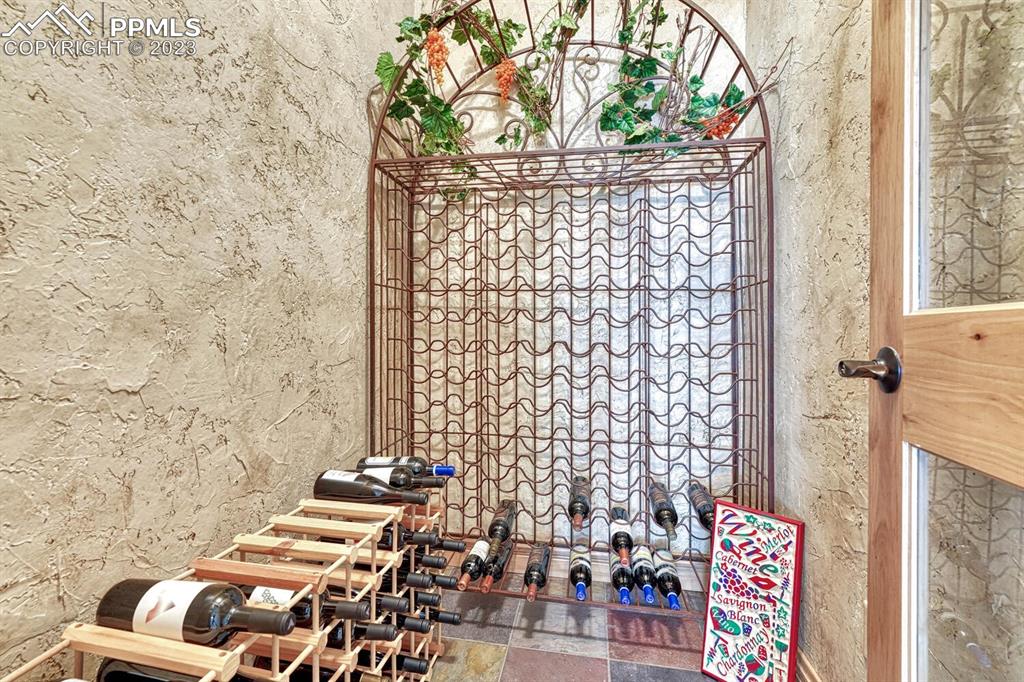 17890 Queensmere Drive Monument, CO 80132 - Photo 29 of 50 a bathroom with a toilet and shower curtain