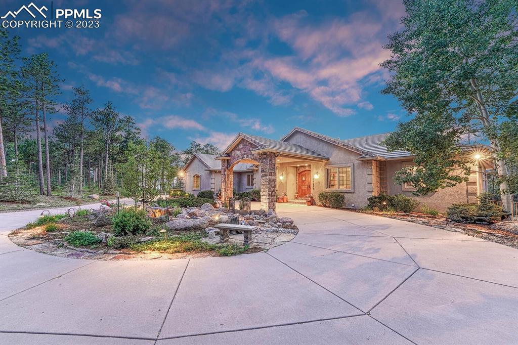 17890 Queensmere Drive Monument, CO 80132 - Photo 39 of 50 a front view of a house with a yard
