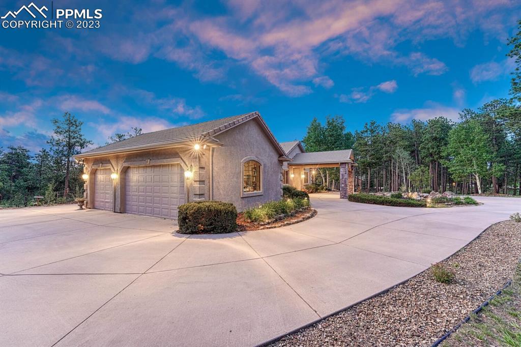 17890 Queensmere Drive Monument, CO 80132 - Photo 41 of 50 a front view of a house with a yard