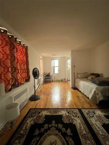 a room with bed and a window