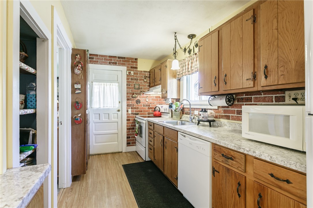 320 Prospect Drive Palmyra, NY 14522 - Photo 11 of 27 door in kitchen leads to bach covered porch