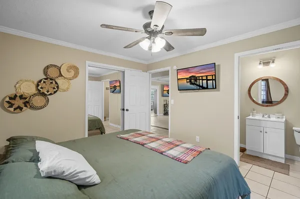 a bedroom with a large bed and a window