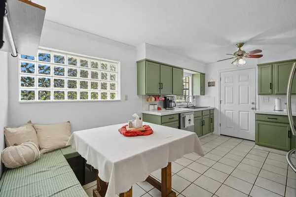 a kitchen with a sink cabinets and window