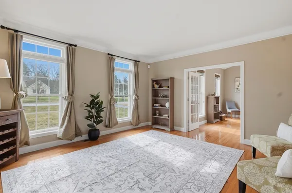 a view of livingroom with furniture and workspace