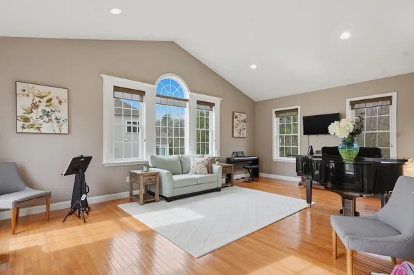 a living room with furniture rug and window