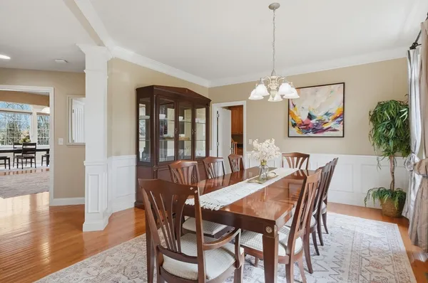 a view of a dining room with furniture window and wooden floor