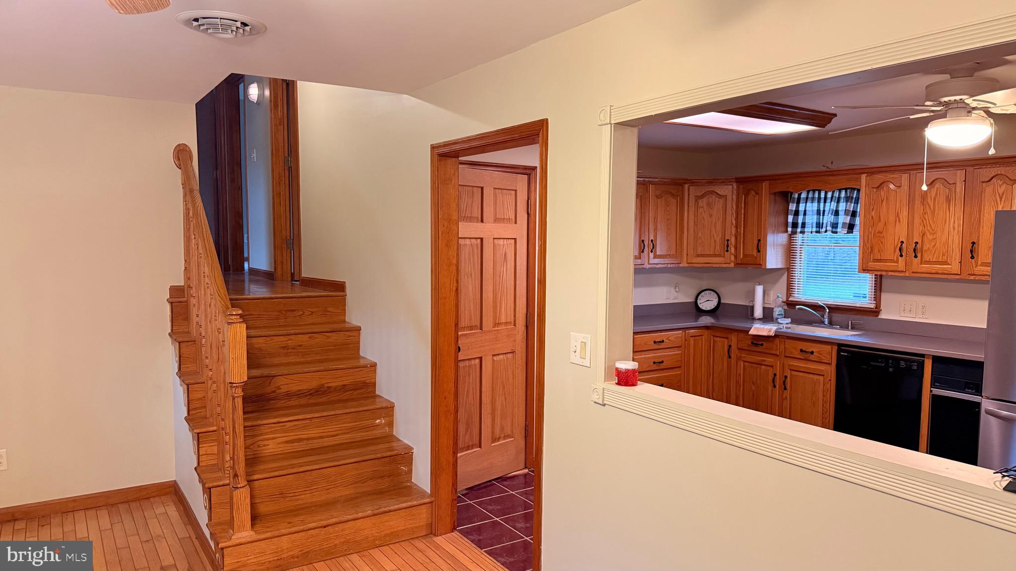 3869 Midstate Road Felton, DE 19943 - Photo 14 of 37 a kitchen with stainless steel appliances granite countertop a refrigerator and a sink