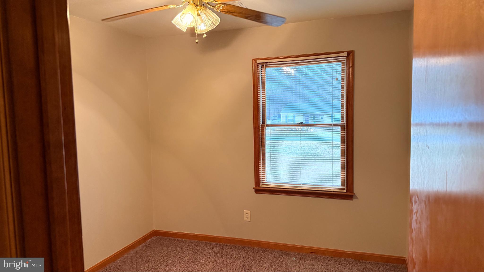 3869 Midstate Road Felton, DE 19943 - Photo 17 of 37 a view of an empty room with closet and wooden floor