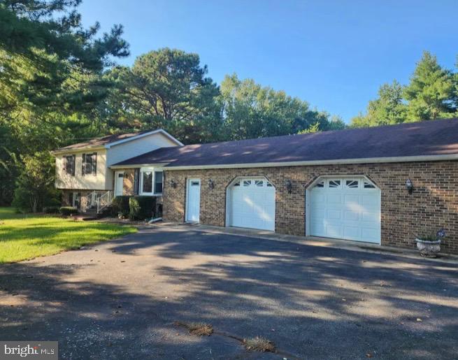 3869 Midstate Road Felton, DE 19943 - Photo 2 of 37 a front view of a house with a yard