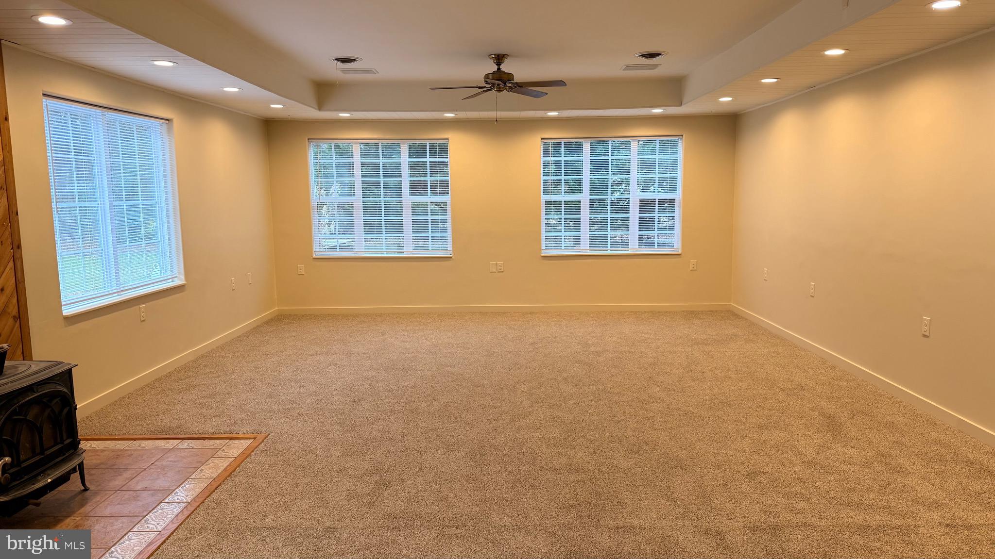 3869 Midstate Road Felton, DE 19943 - Photo 6 of 37 a view of an empty room with windows